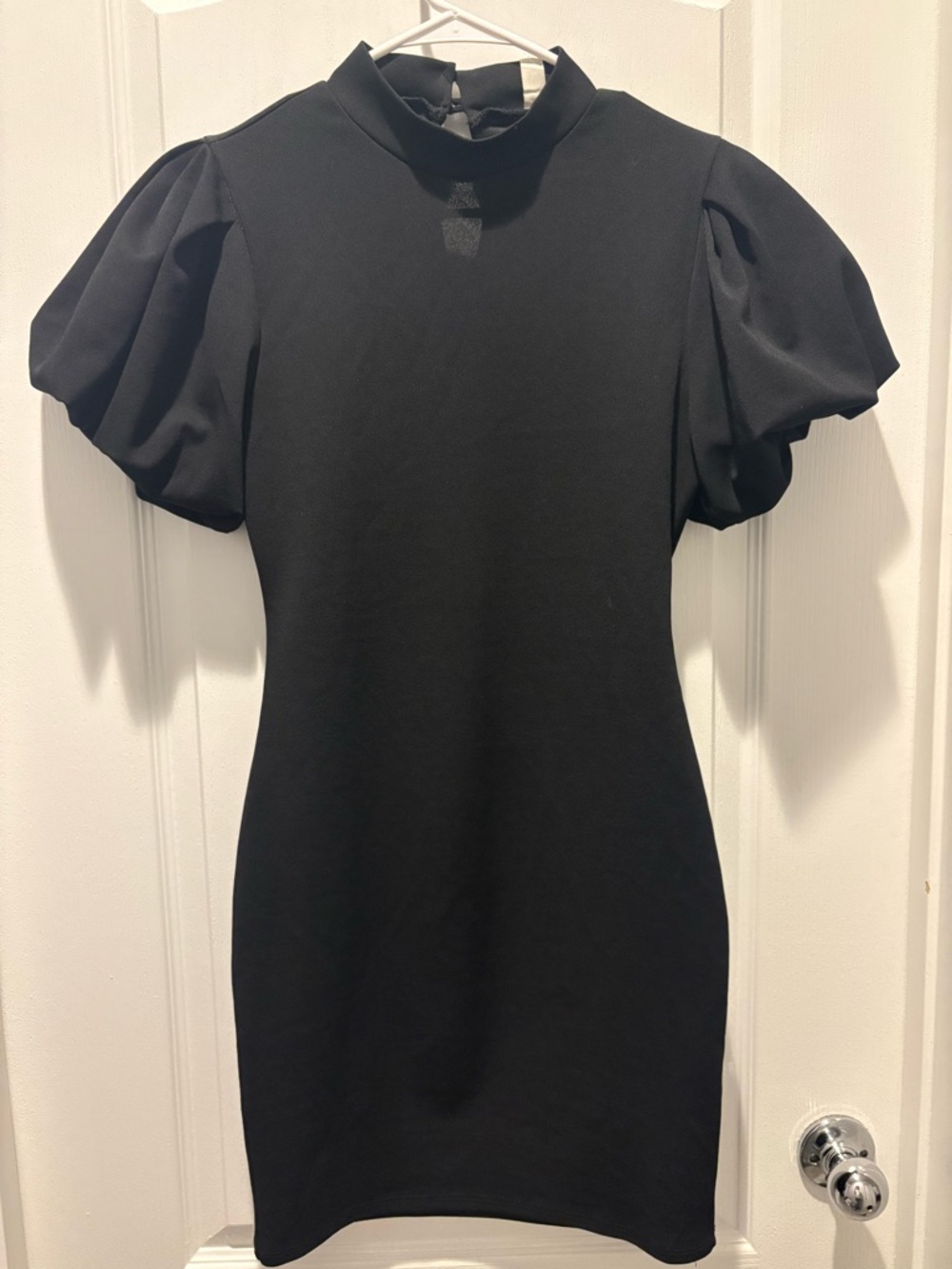 Y2K black minidress by A'gaci features puffed short sleeves